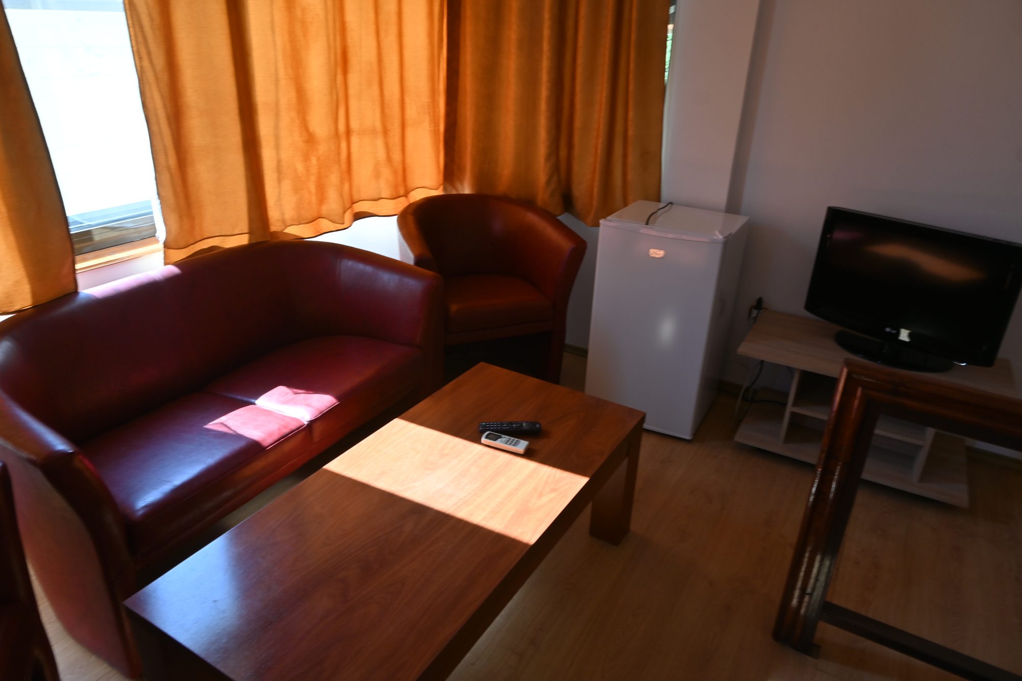 Villa living room with sofa, TV and fridge, Miotur